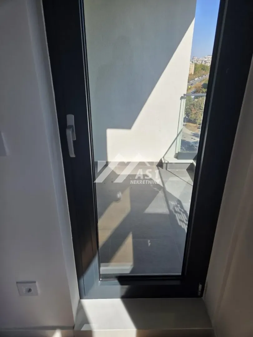 View of the terrace through the balcony door.
