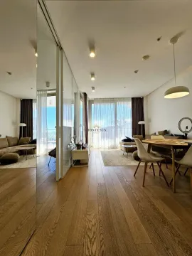 Spacious living room with dining area and access to the terrace. - image 3