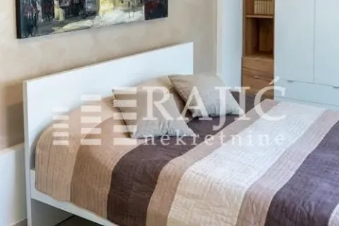 Furnished bedroom with a double bed and wardrobe. - image 16