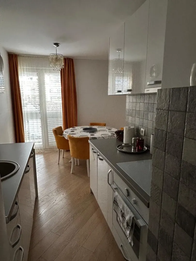 Kitchen with dining area and access to the terrace.