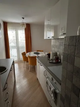 Kitchen with dining area and access to the terrace. - image 5