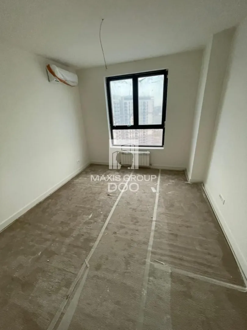 Empty unfurnished room with an air conditioner and a window.