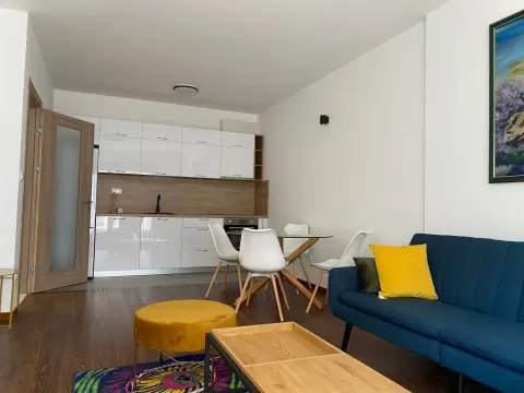 Living room with a kitchen and a dining table. - image 7