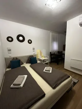 Decorated bedroom with a double bed. - image 12