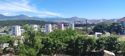View from the terrace towards the city and mountains in the background. - image 8