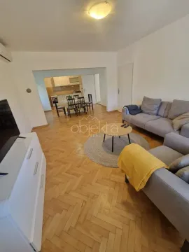 Spacious living room with a sofa set and a view of the dining area. - image 6