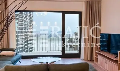 Living room with sofa, TV and access to the terrace. - image 4