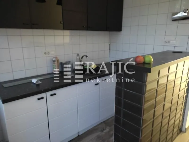 View of a modern kitchen equipped with a bar counter.