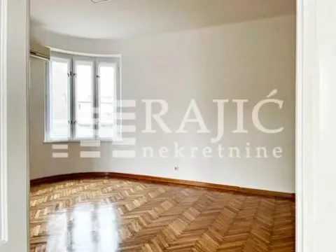 Empty room with parquet flooring and windows. - image 4