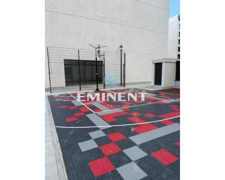 Outdoor sports court with a basketball hoop within the residential complex. - image 13