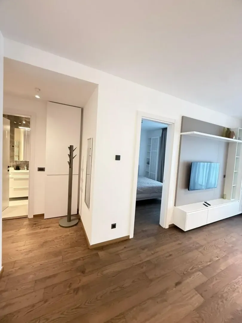 View from the living room towards the hallway, bathroom, and bedroom.