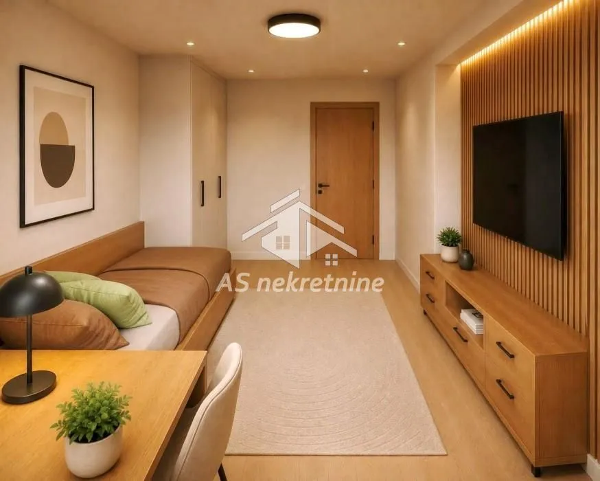 Smaller bedroom with a bed, desk, and wall-mounted TV.