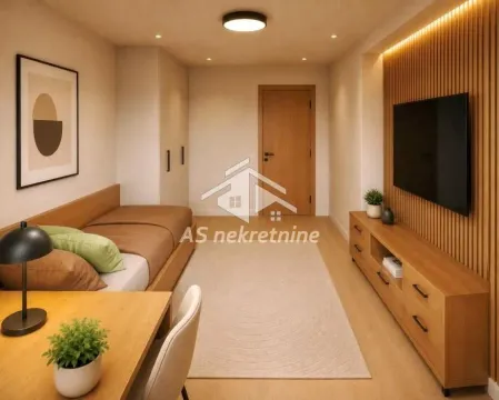 Smaller bedroom with a bed, desk, and wall-mounted TV. - image 7
