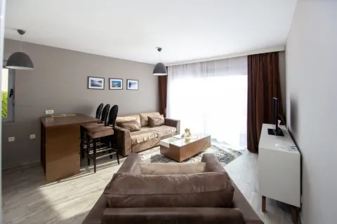 Spacious and furnished living room with sofa set and dining table. - image 2
