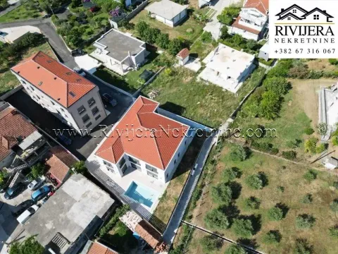 Aerial view of the house with a swimming pool and yard. - image 16