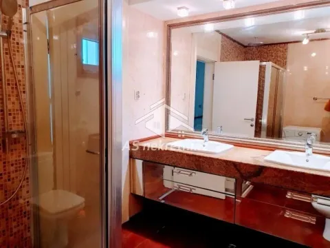 Bathroom with double washbasin, large mirror and shower cabin. - image 15