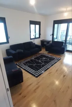 Spacious living room with sofa set and terrace access. - image 2