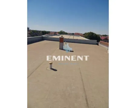 View of the flat roof of the building with the surrounding neighborhood. - image 15
