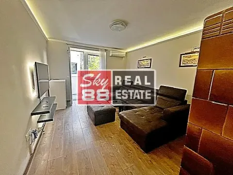 Living room with sofa set, TV, and access to the terrace. - image 2