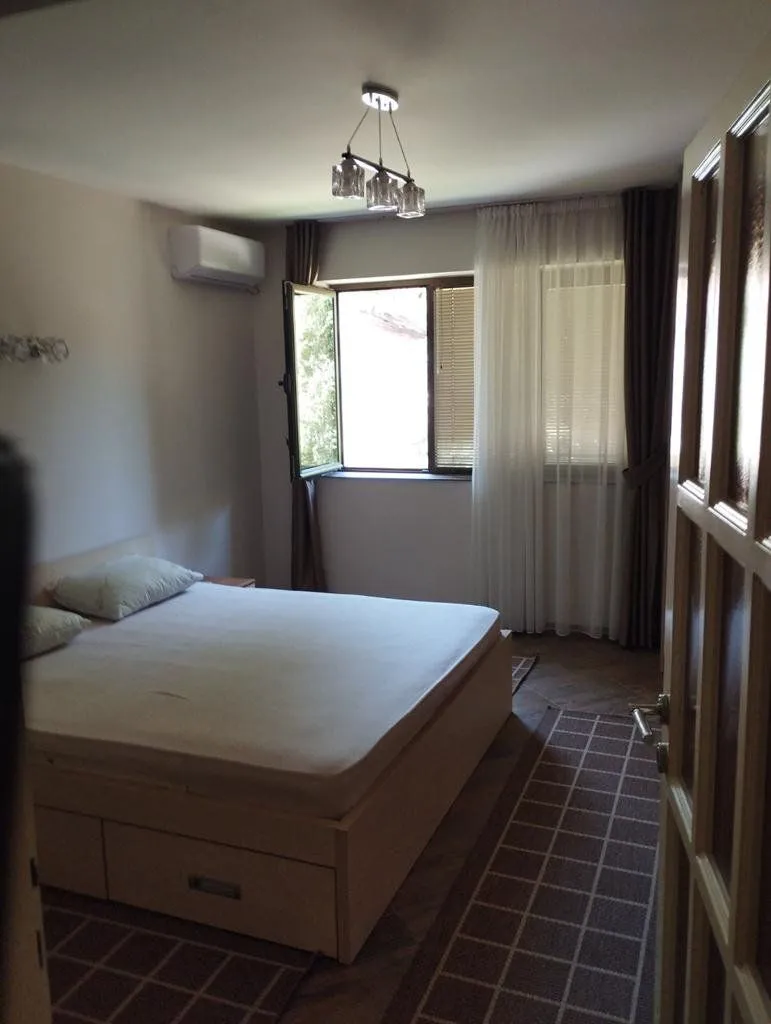 Bedroom with a double bed and a window.