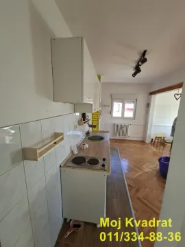 Smaller kitchen with a built-in cooktop and sink. - image 5