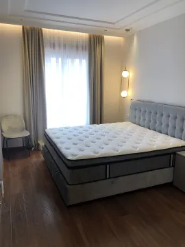 Bright bedroom with a large double bed and modern lighting. - image 17