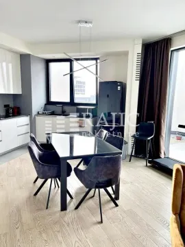 Modern kitchen with dining area and access to the terrace. - image 9