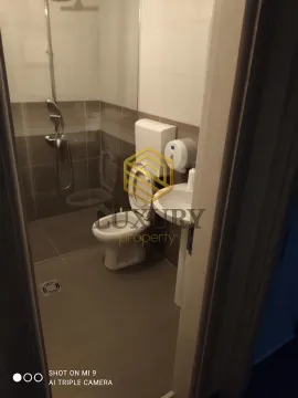View of a modernly equipped bathroom with a walk-in shower. - image 5
