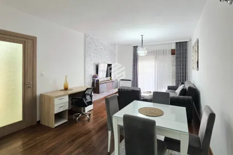 Spacious living room with a dining area and a desk. - image 17