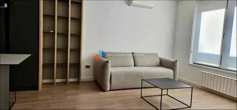 Dnevna soba sa garniturom, policom za knjige i stočićem. - image 11