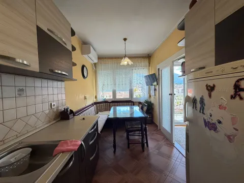 Small kitchen with dining area and access to the terrace. - image 2