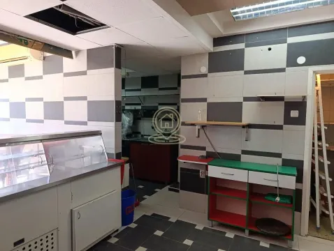 Kitchen with checkered tiles and a working counter. - image 5