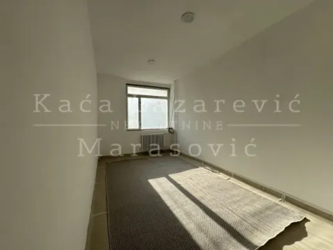 Empty room with a window and a large rug on the floor. - image 17