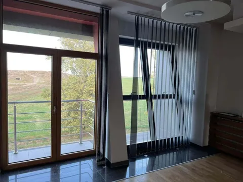 Living room with large glass surfaces and access to the terrace. - image 8