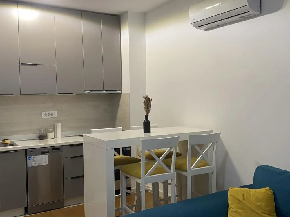 Smaller kitchen with a dining table and chairs.