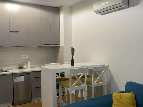 Smaller kitchen with a dining table and chairs. - image 7