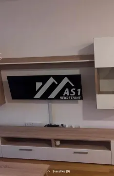 Deo dnevnog boravka sa TV komodom i zidnim elementima. - image 3