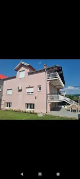 Exterior of a pink house. - image 25
