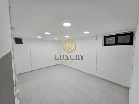 Empty bright room with white walls and recessed lighting. - image 5