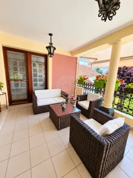 Covered terrace with rattan lounge furniture. - image 11