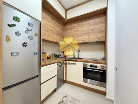 Small kitchen with wooden elements and built-in appliances. - image 6
