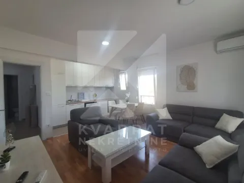 Living room with sofa set and dining area connected to the kitchen. - image 3
