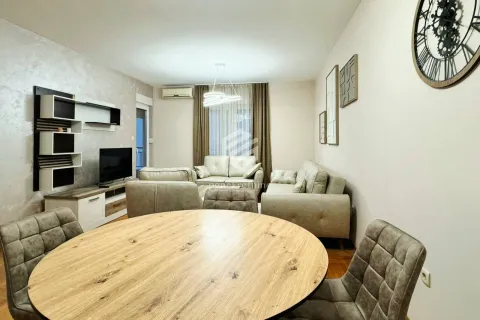 Living room with a sofa set and a dining table. - image 13