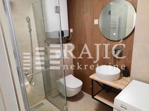 Modernly equipped bathroom with a shower cabin.
