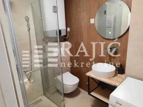 Modernly equipped bathroom with a shower cabin. - image 8