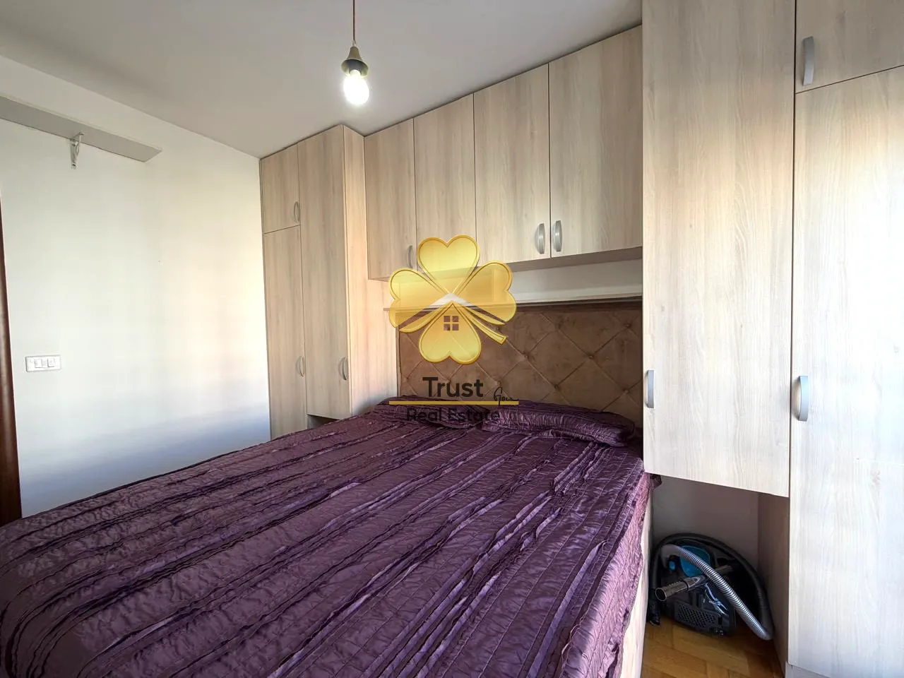 Bedroom with a double bed and built-in wardrobes.