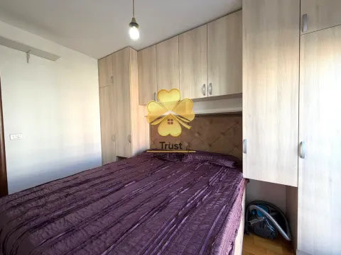Bedroom with a double bed and built-in wardrobes. - image 12