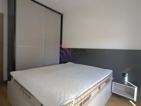 Bedroom with a double bed, wardrobe and a nightstand. - image 5
