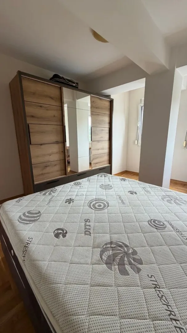 Bedroom with a large wardrobe and a double bed.