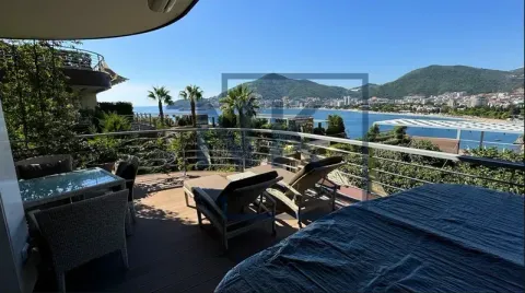 Spacious terrace with outdoor furniture and a sea view. - image 2
